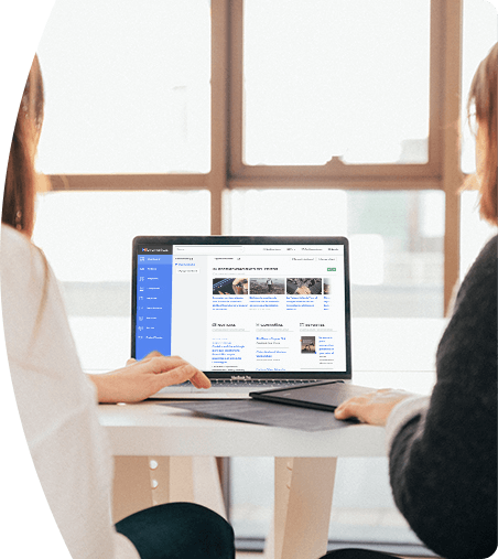 Two professionals analyzing the BNamericas platform during a strategic meeting.